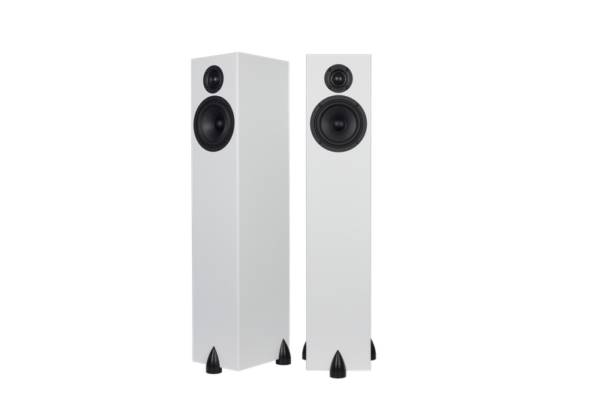 Two sleek white Totem - Bison Tower floor-standing speakers with black circular drivers and triangular feet, positioned side by side.