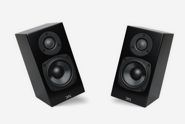 Two Totem - Kin One - Bookshelf Speakers in black, each featuring a smaller tweeter and a larger woofer, angled towards each other against a plain white background.